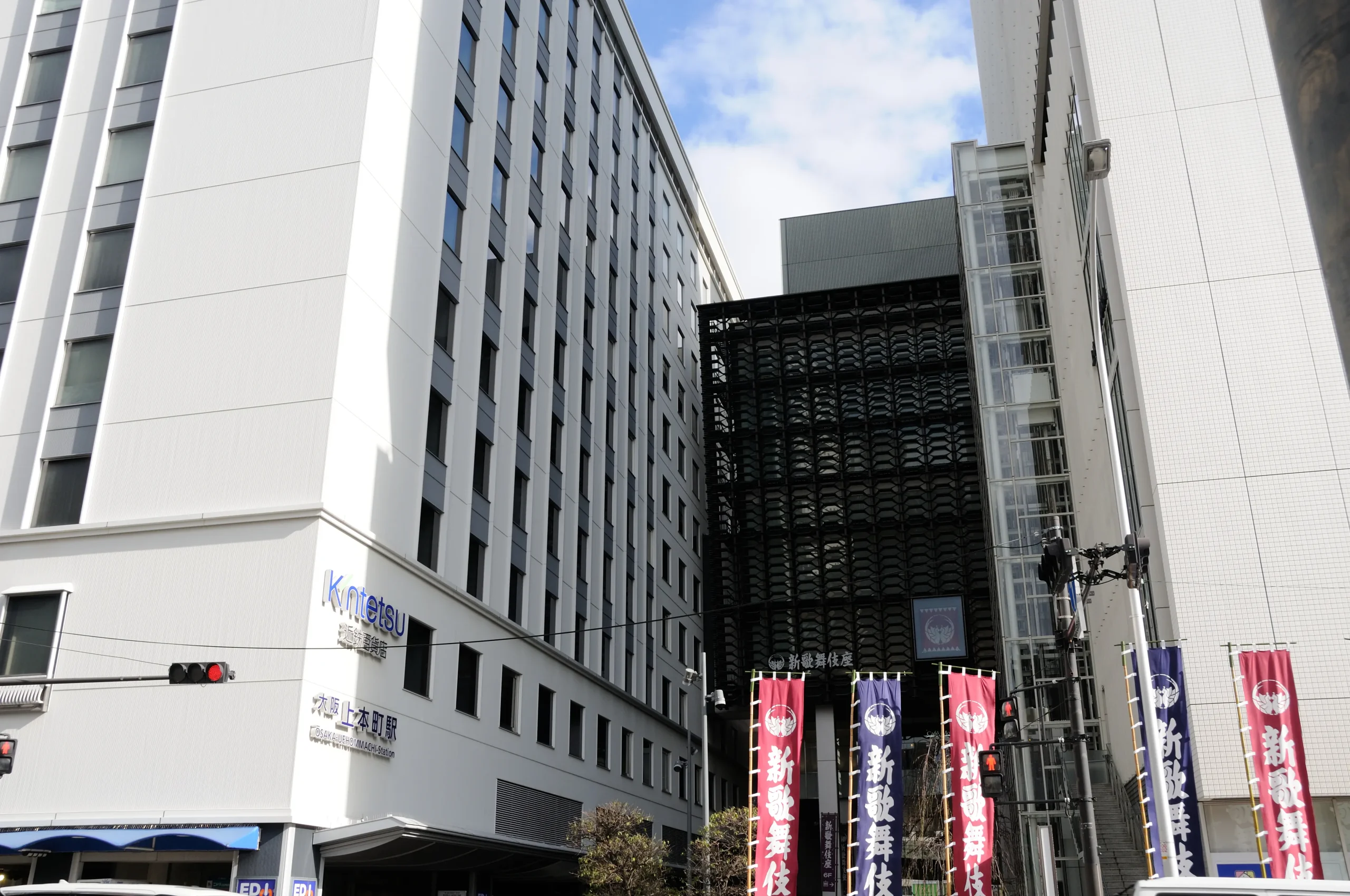 Shin-Kabukiza Theatre visible beyond the station in Osaka.