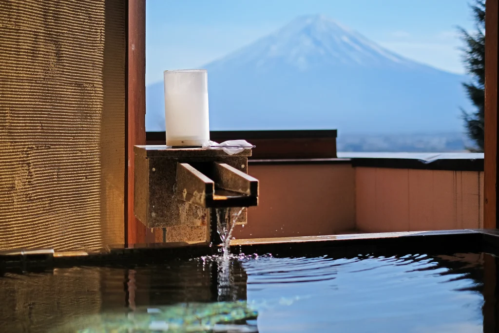 Outdoor hot-spring bath overlooking Mount Fuji and Lake Kawaguchiko in Japan