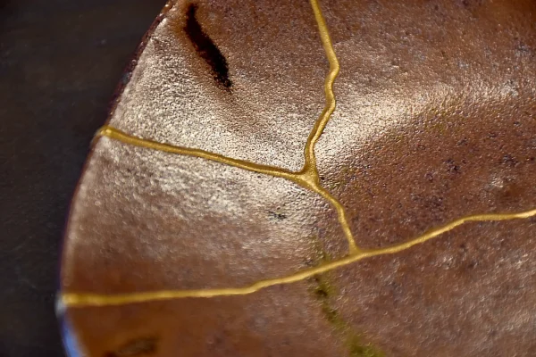 Traditional Imari porcelain plate restored with kintsugi gold repair, Japan